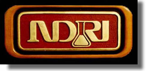 NDRI carved wood sign by Fred Schlatter