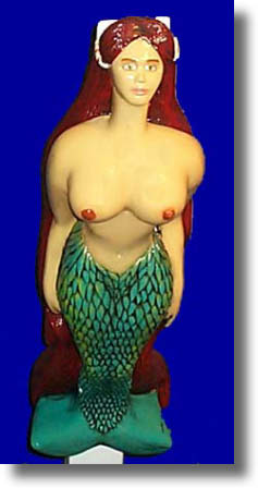 Finished hand carved figurehead mounted on boat